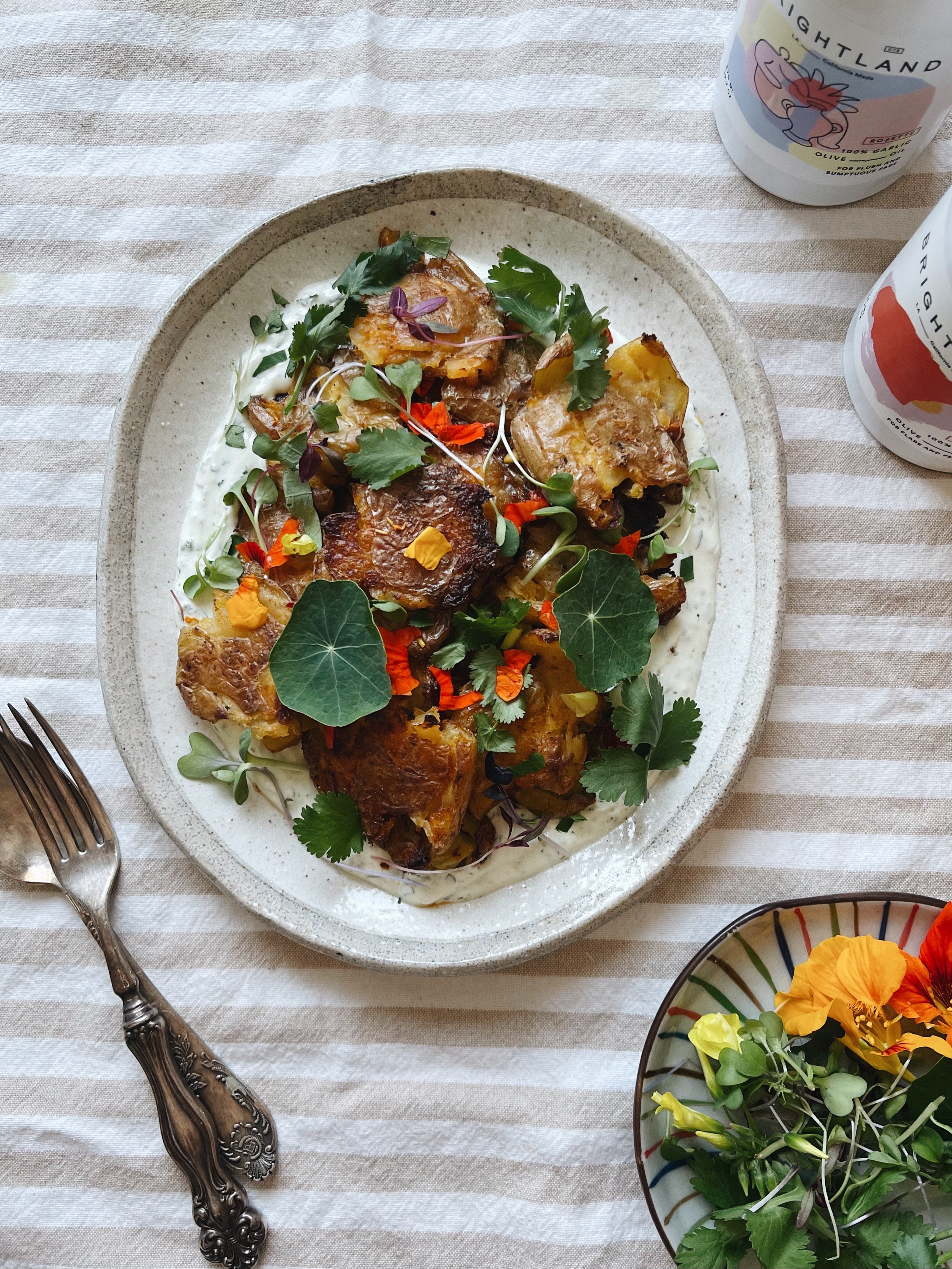 Crispy, Spicy Smashed Potatoes with Garlic Cilantro Labneh