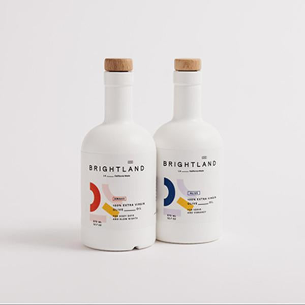 two bottles of brightlands alive and awake olive oils