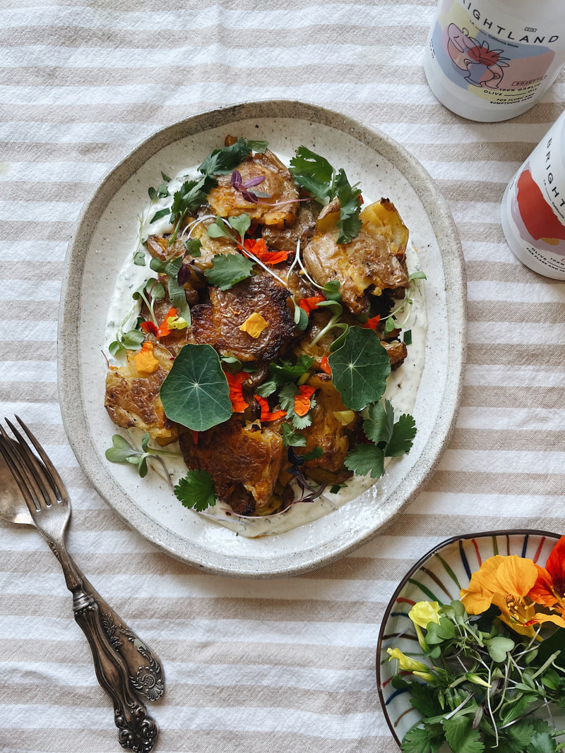 Crispy, Spicy Smashed Potatoes with Garlic Cilantro Labneh