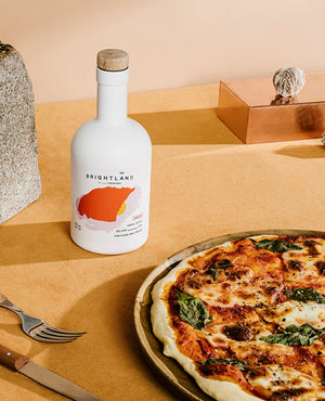 olive oil next to pizza